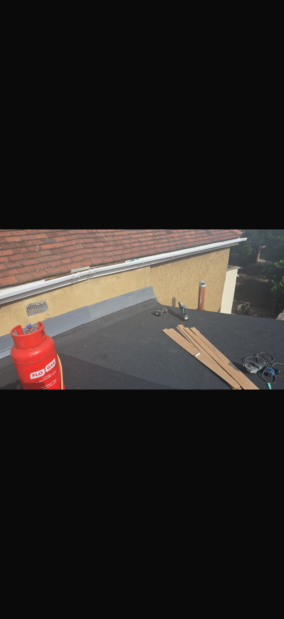 Tiled roof slope with a rooflight and neatly finished verge