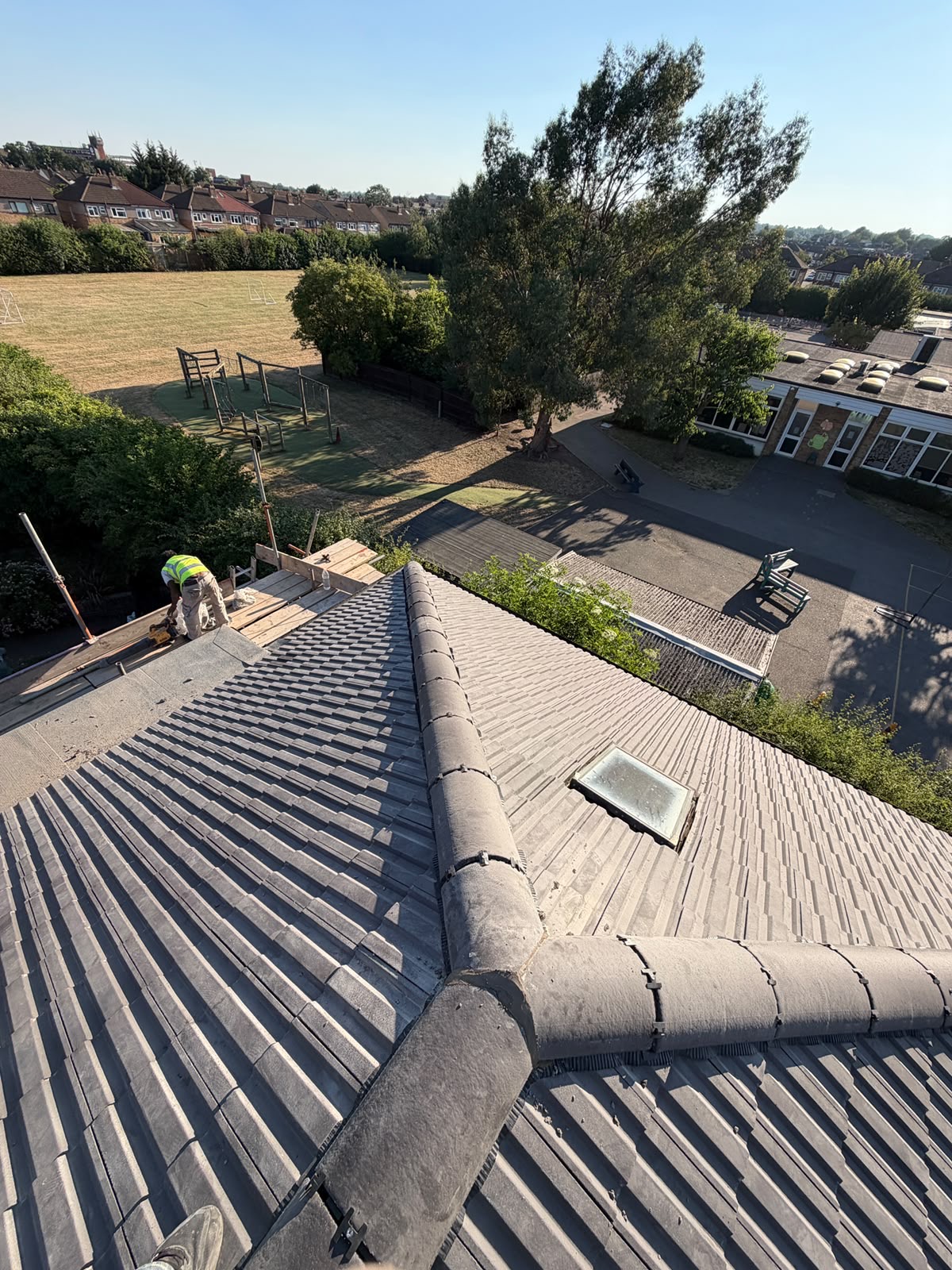 Finished tiled roof on a semi-detached house under a clear sky