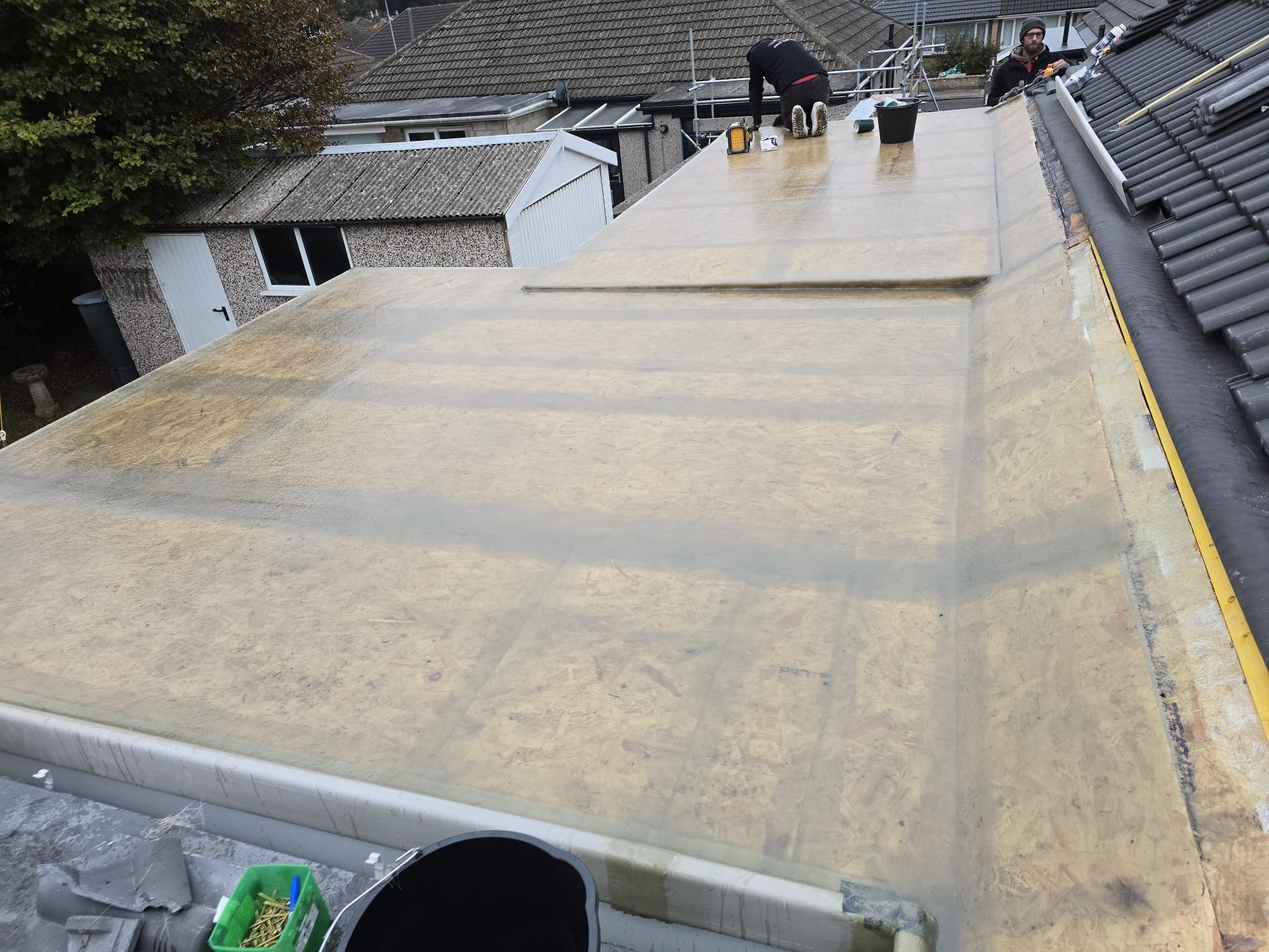 Guttering and downpipe fitted to a house wall