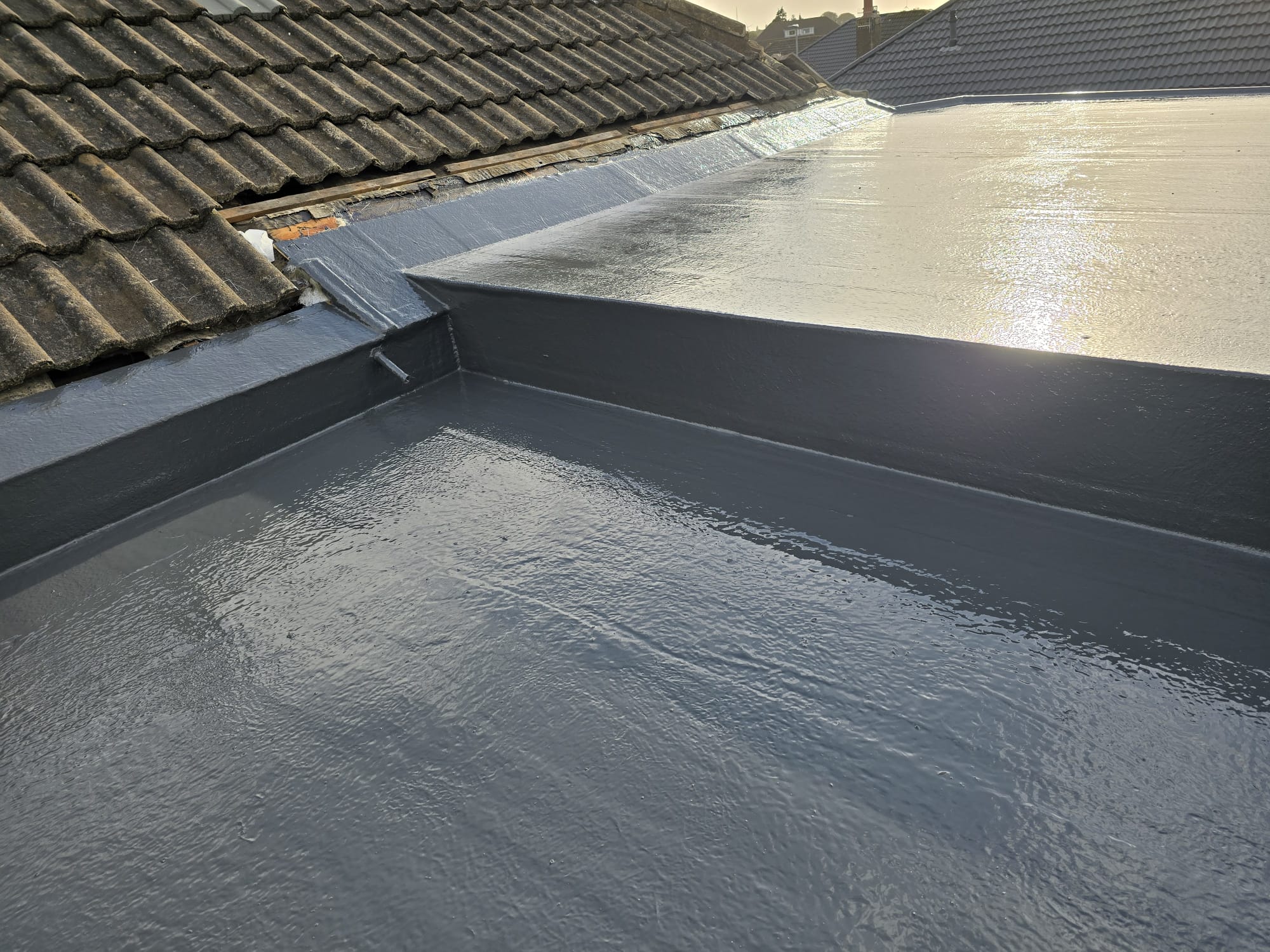 Roof hip line with new tiles running down it