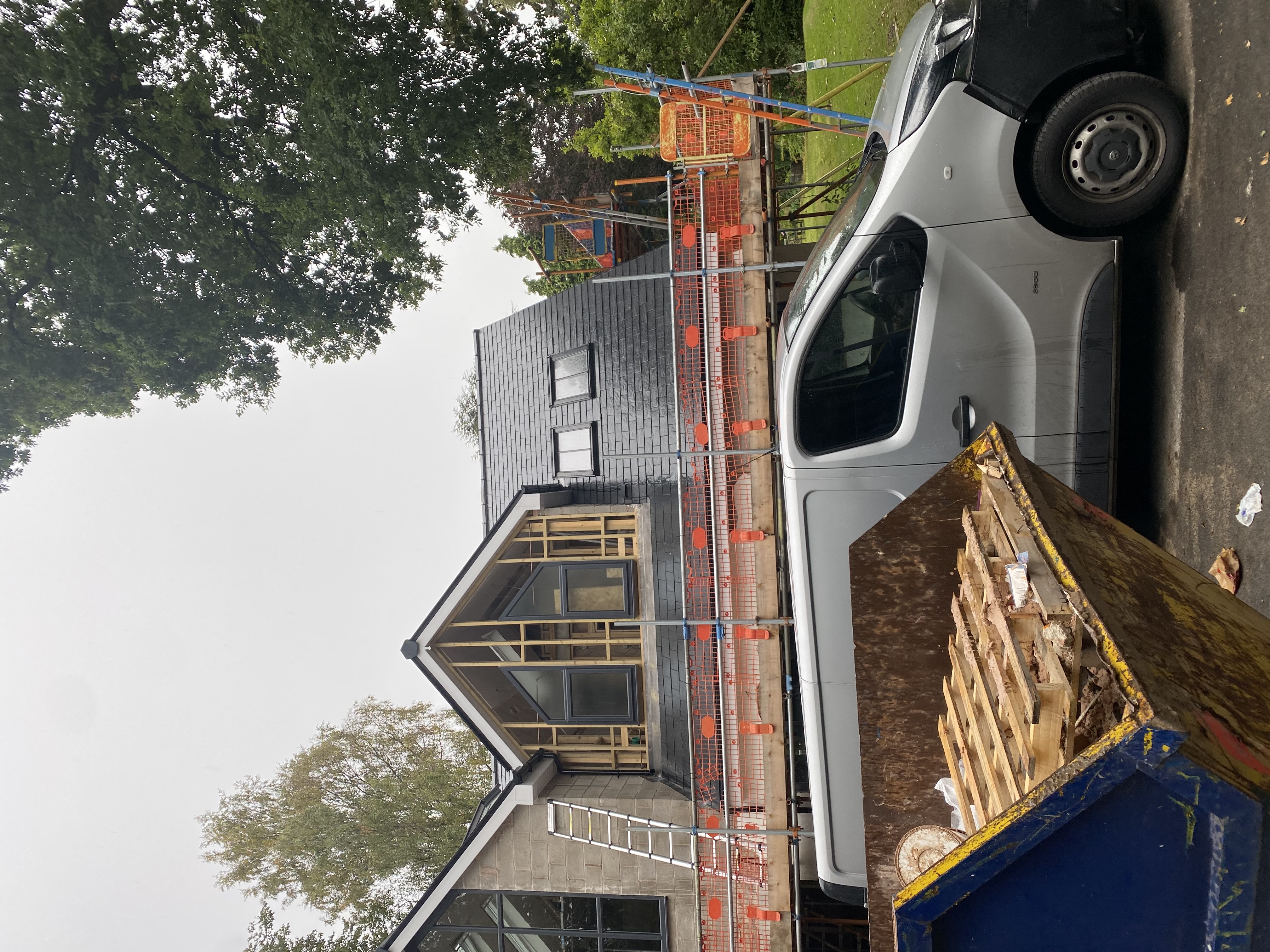 Roof hip and valley finished in slate on a detached property