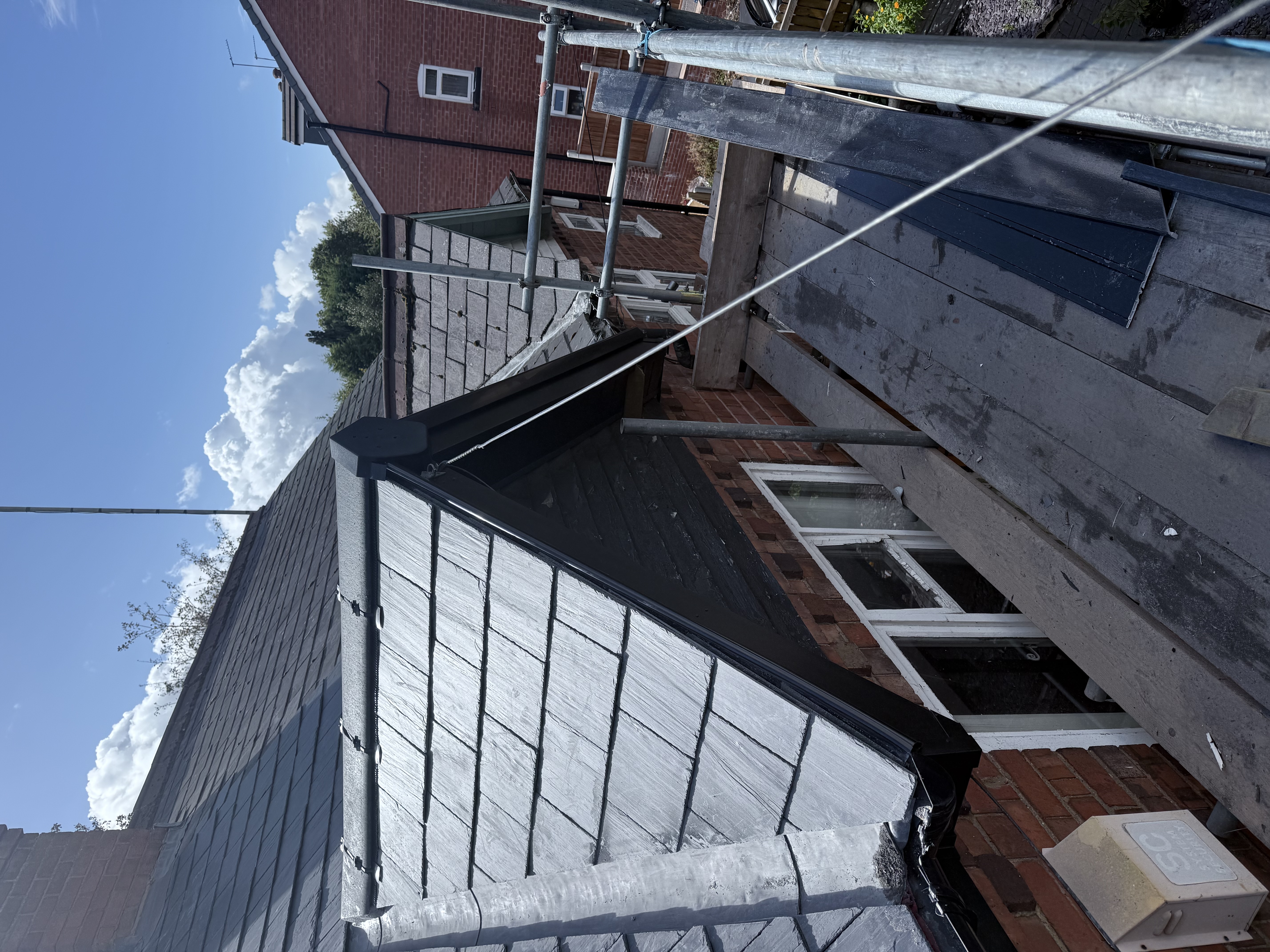 Roof covering completed over a garage and main house together