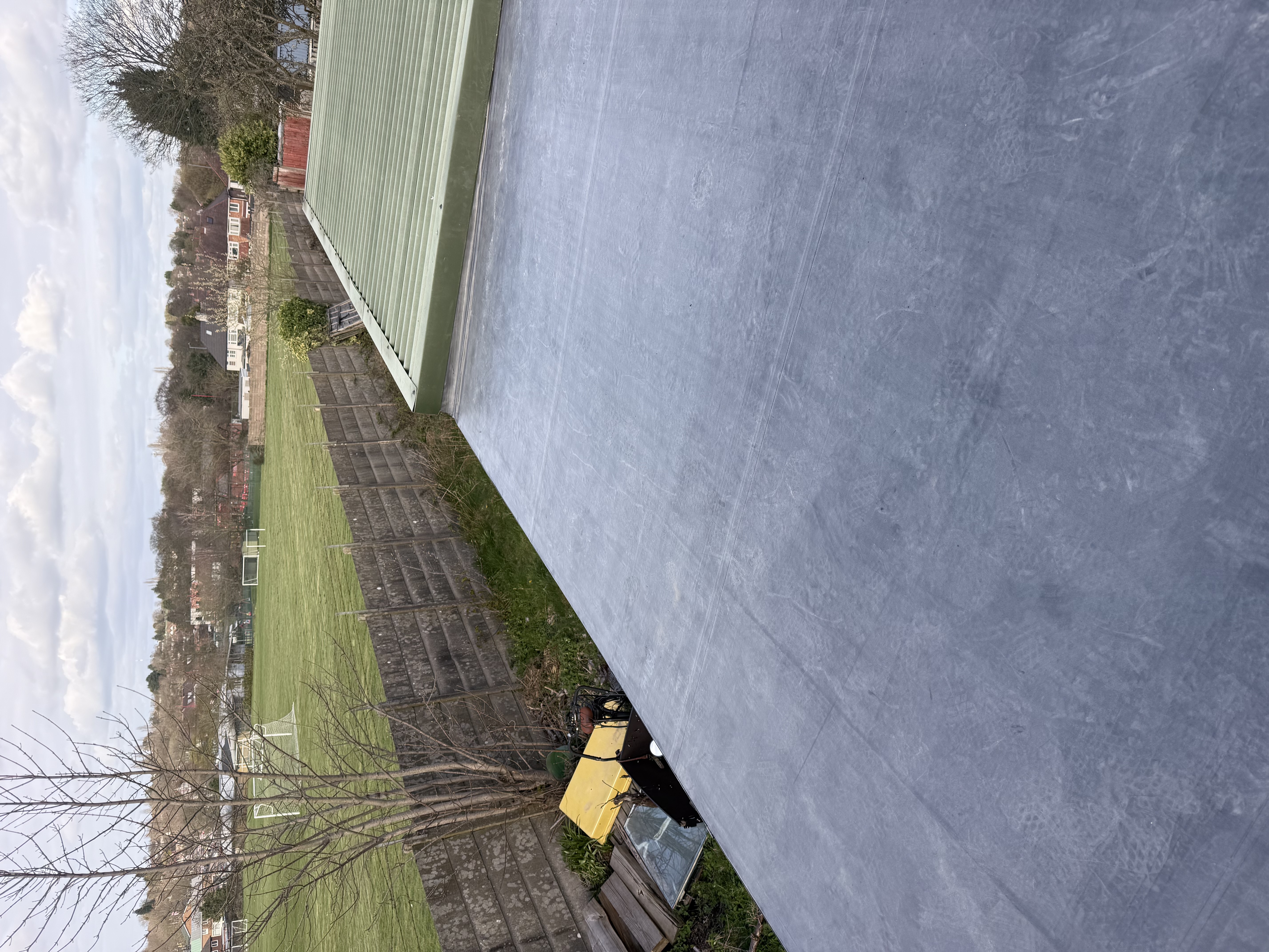 Finished flat roof with upstand and new trim edging