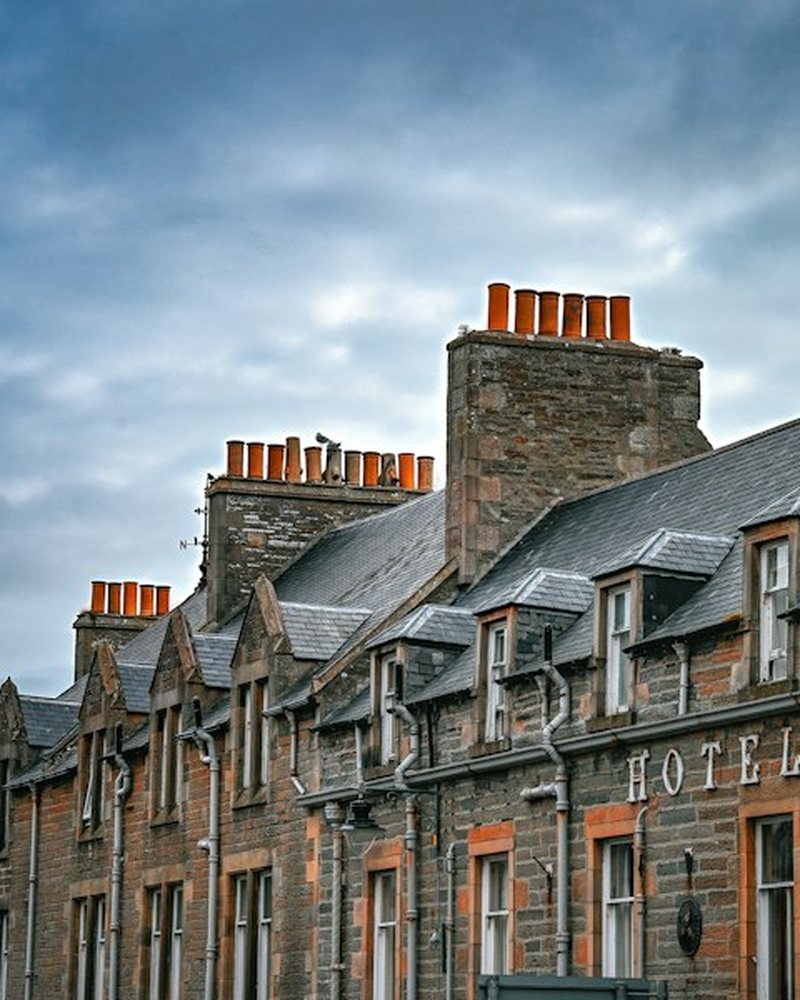 Stone terrace with slate roofs and dormer windows