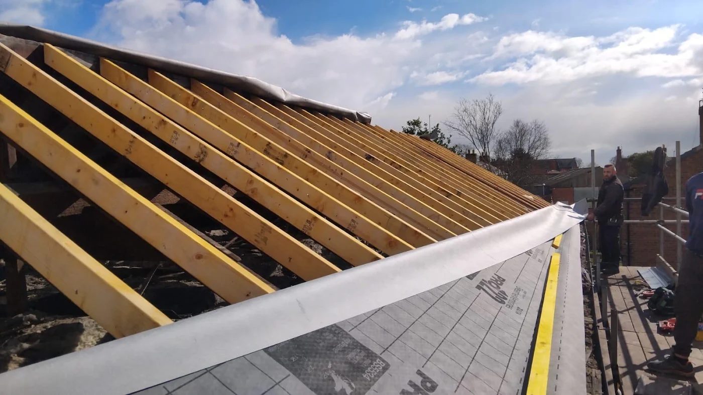 New timber rafters and membrane on an extension roof being framed