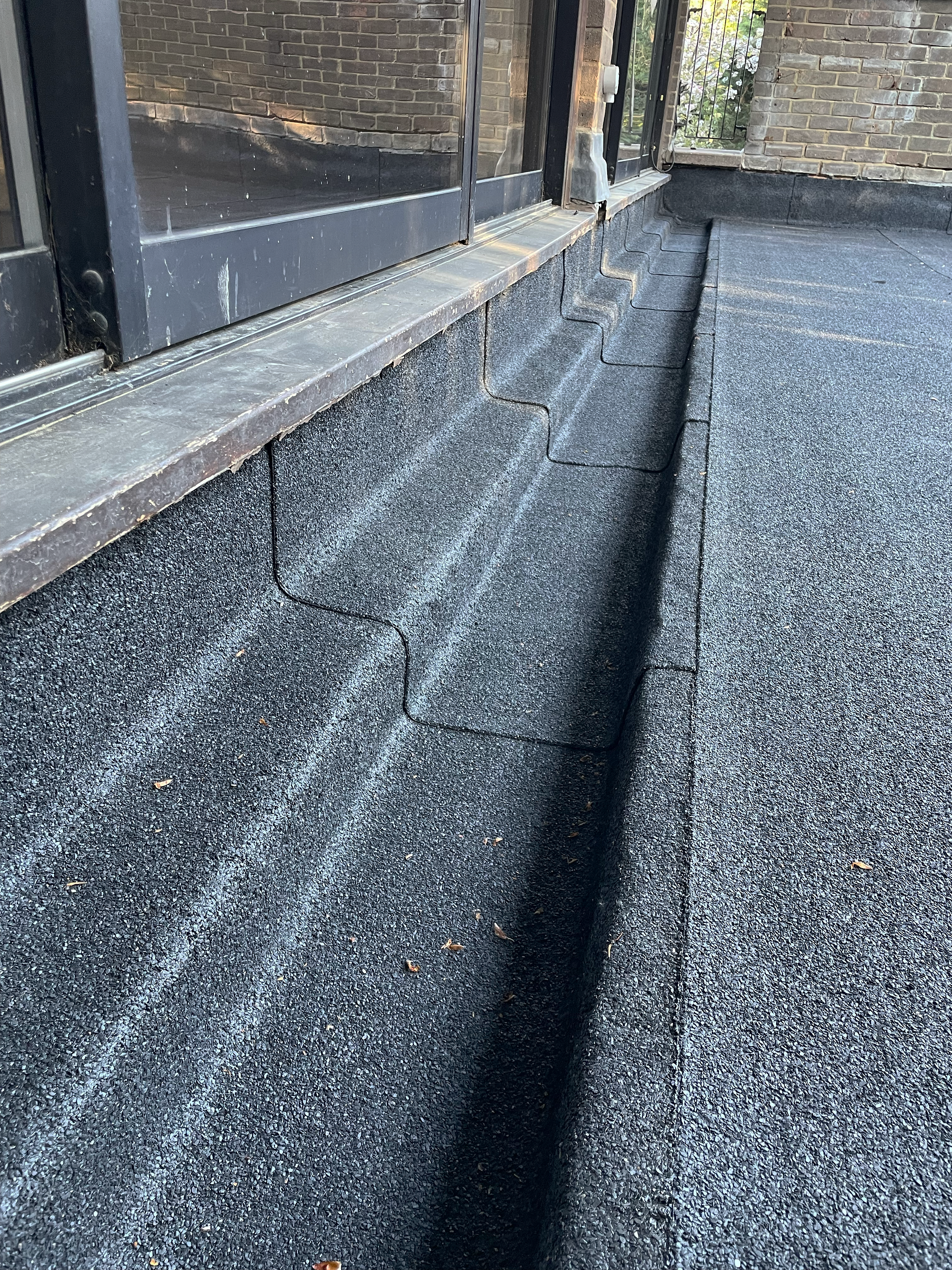 Roof mid-way through being stripped, with new timber battens and breathable membrane exposed