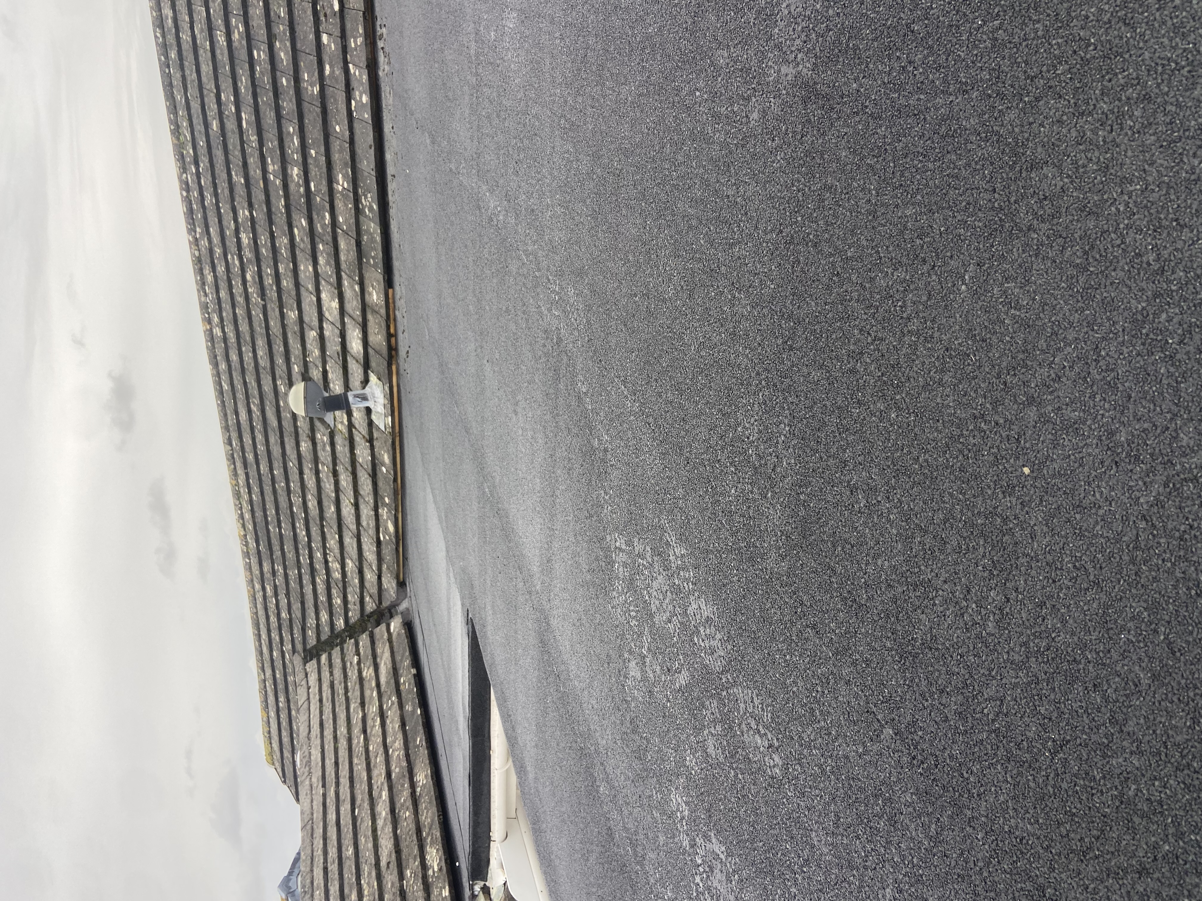 Close view of roof tiles laid in neat courses