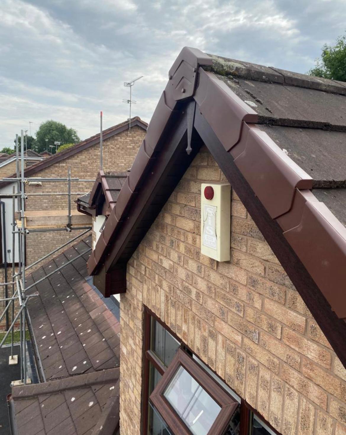 Brown verge trim fitted neatly to a house roof edge