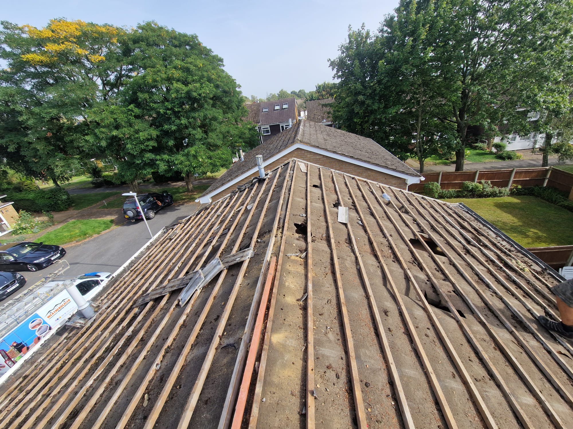 Timber battens laid across a pitched roof ready for tiles