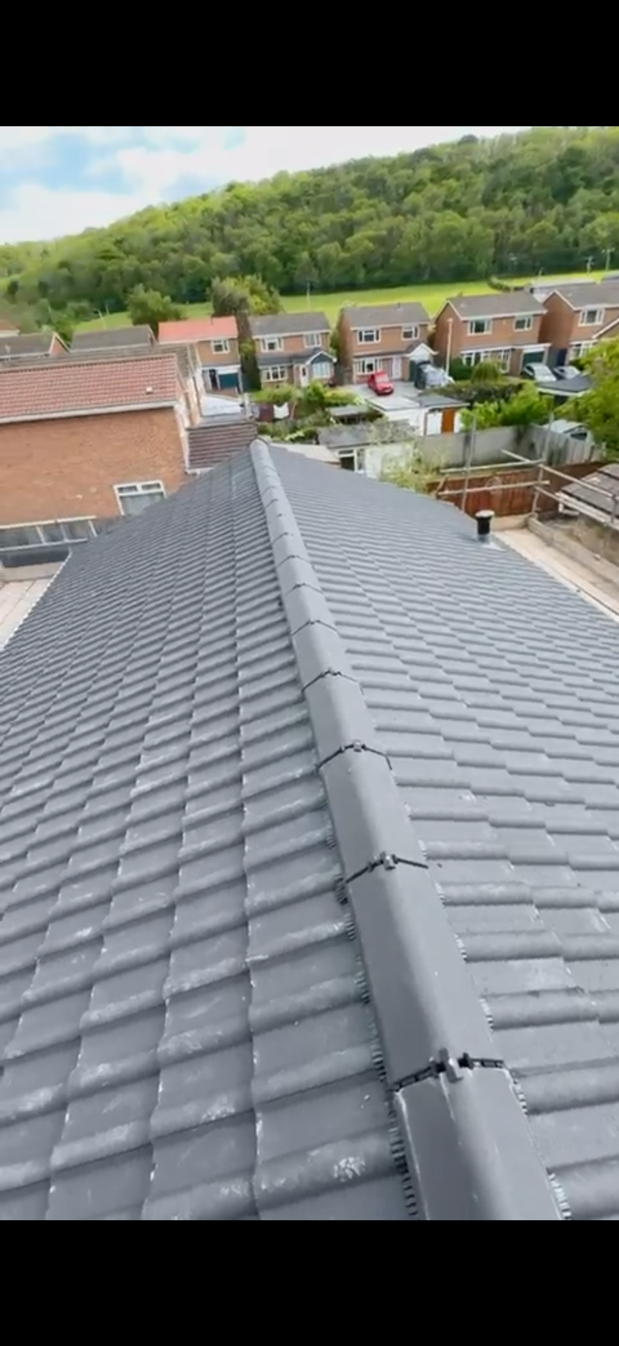 Completed light grey tiled roof with matching ridge tiles