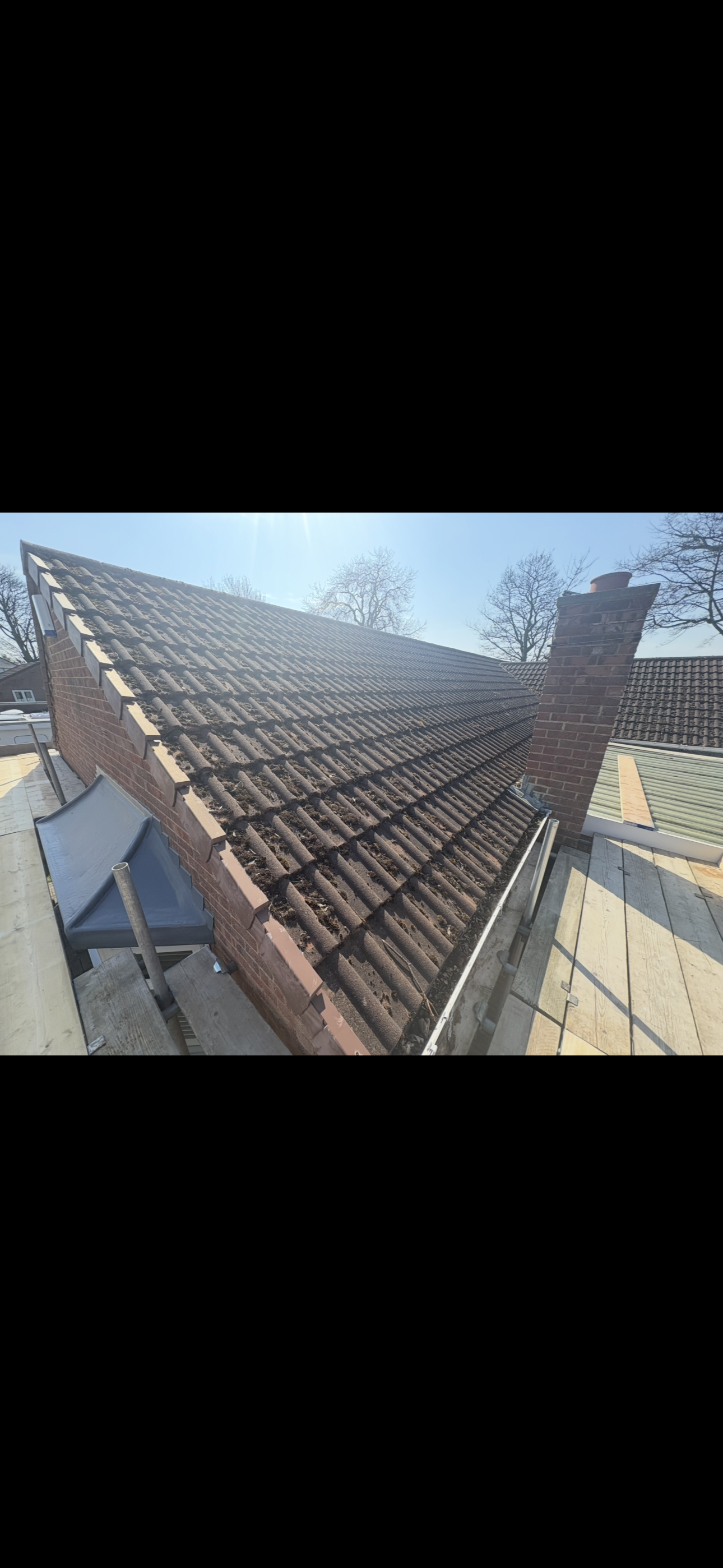 Roof surface and chimney stack viewed from working height