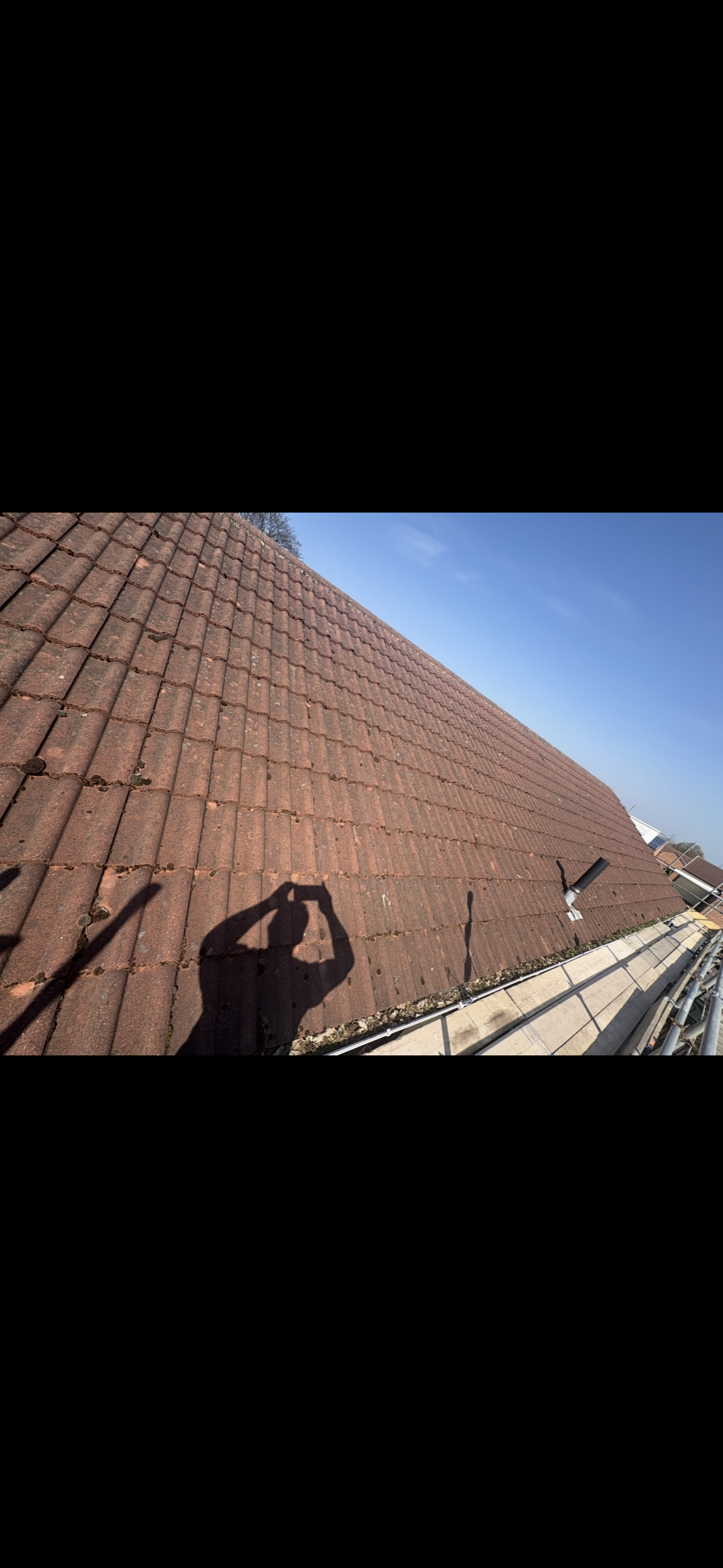 Guttering and fascia board running along the eaves of a house