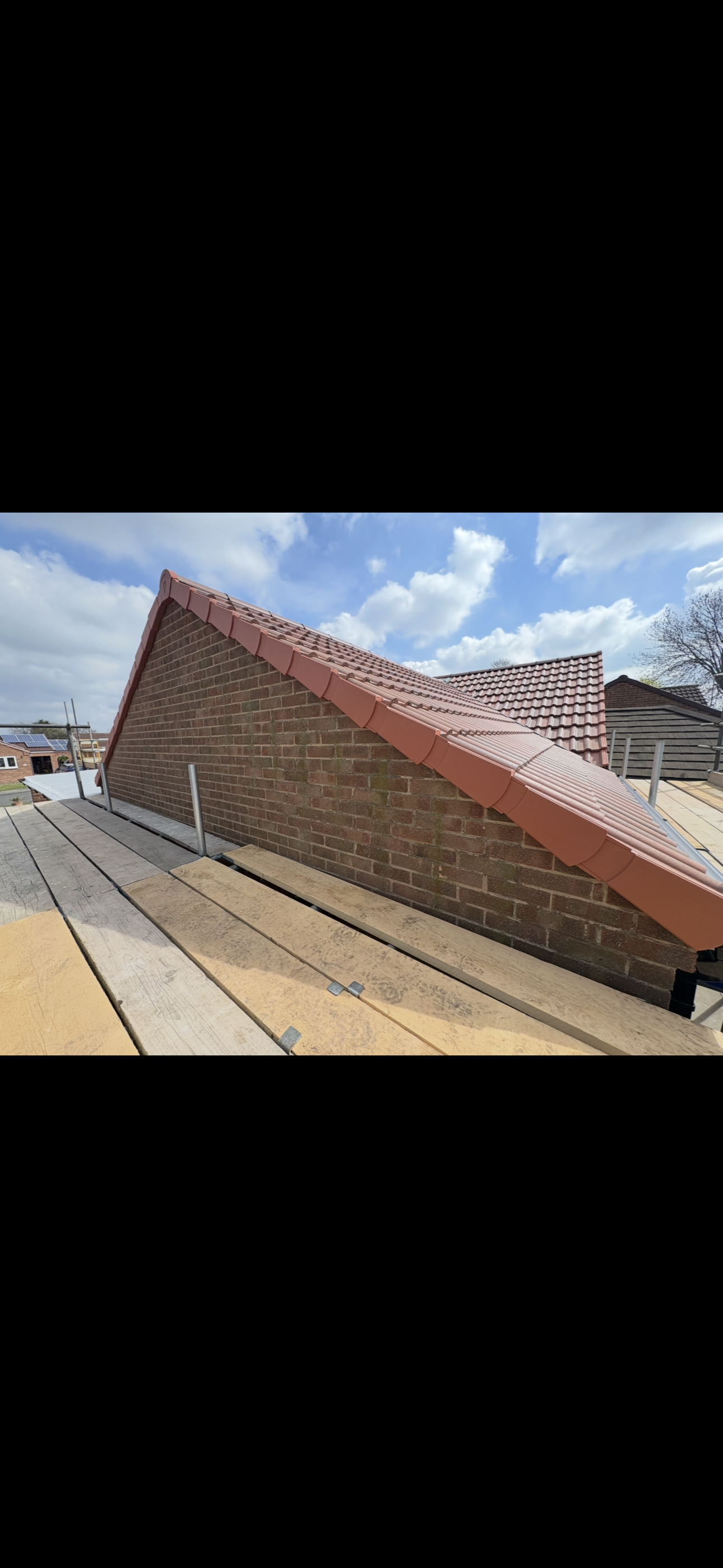 Chimney stack with repointed brickwork and lead flashing
