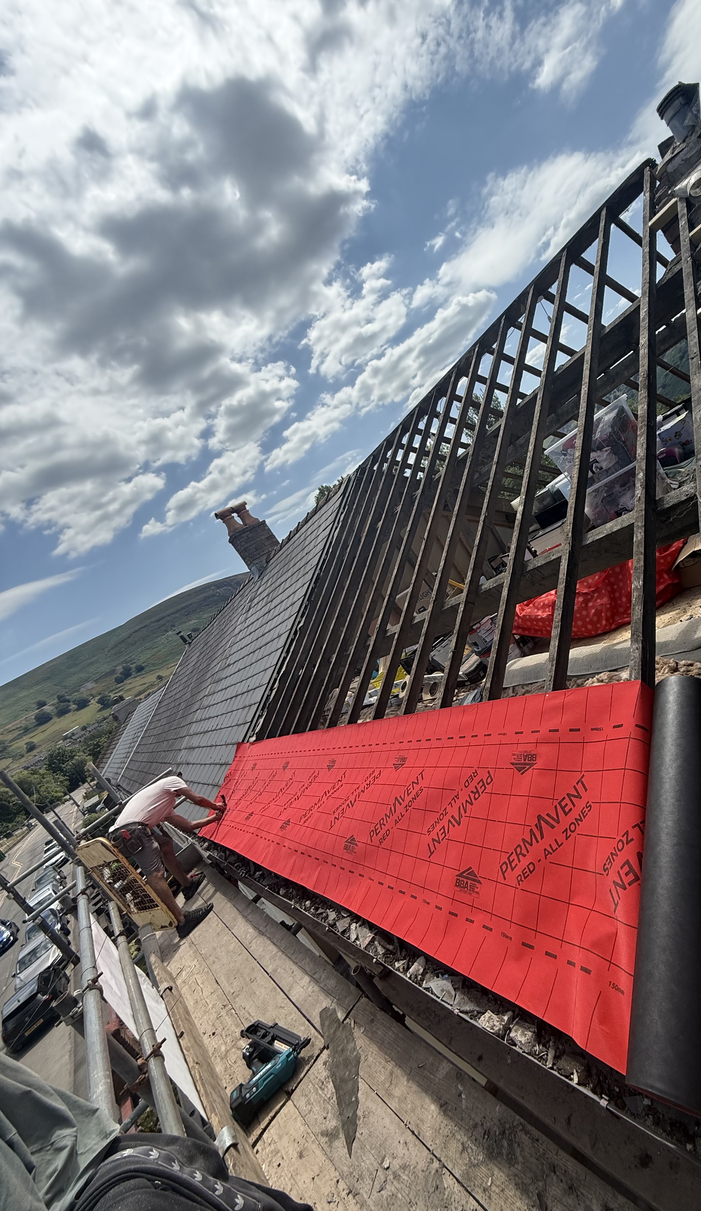 Roof slope with tiles and flashing photographed on site by ASM & Sons