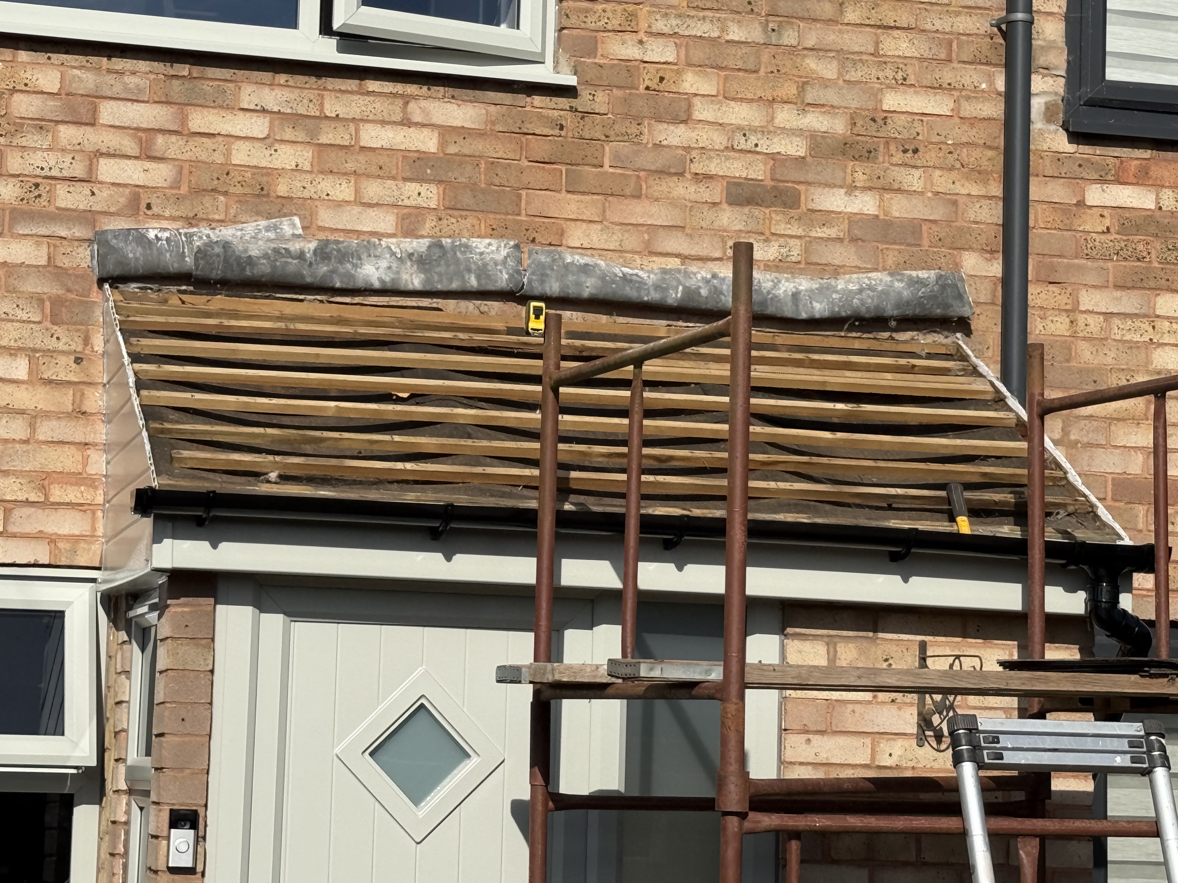 Roof and chimney stack on a house worked on by ASM & Sons Roofing